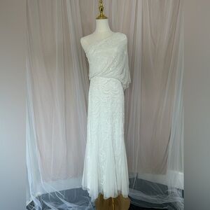 Adrianna Papell one shoulder wedding gown. Hand beaded with flutter style bottom